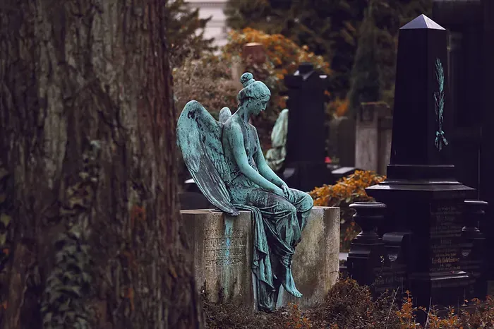 sitting-angel-statue.webp